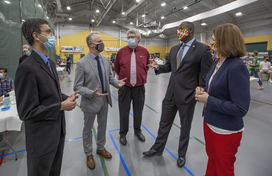 Calvin Ball with other officials at vaccine clinic