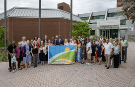 Group shot at flag raising ceremony July 2025