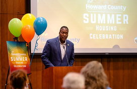 County Executive at podium at Summer Housing Celebration