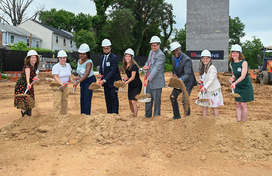 A photo of County Executive Calvin Ball and other's breaking ground on Enterprise Community Development's two new affordable housing redevelopment projects in Columbia.