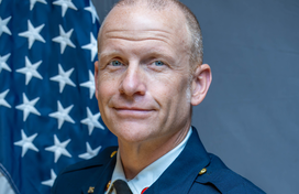 Jeremy Clancy in front of US Flag