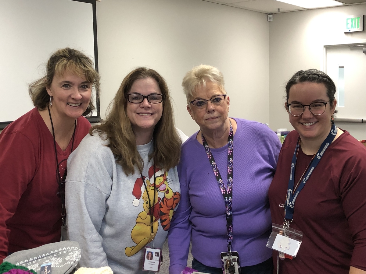 Office on Aging and Independence staff pose for a photo while volunteering for Project Holiday.