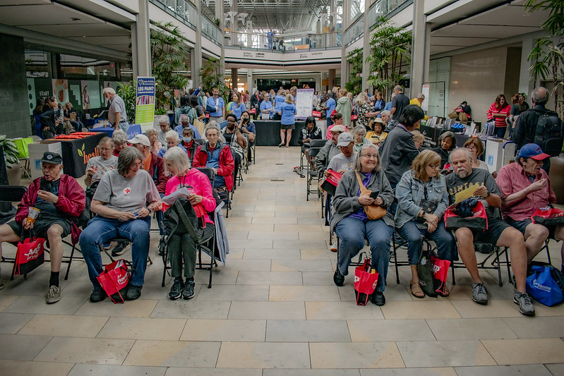 Full view of the audience at the showcase with mall in the background