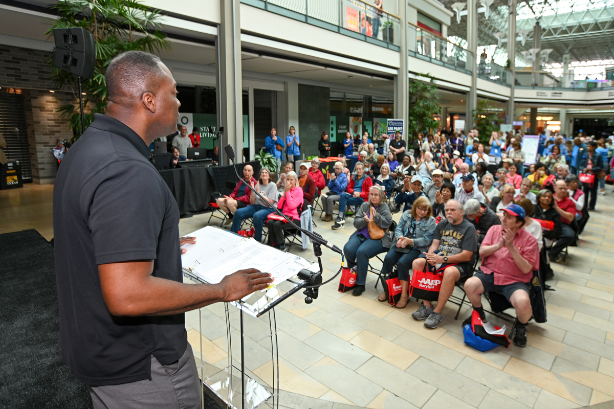 County Executive Calvin Ball speaking to around 60 seated guests at the showcase