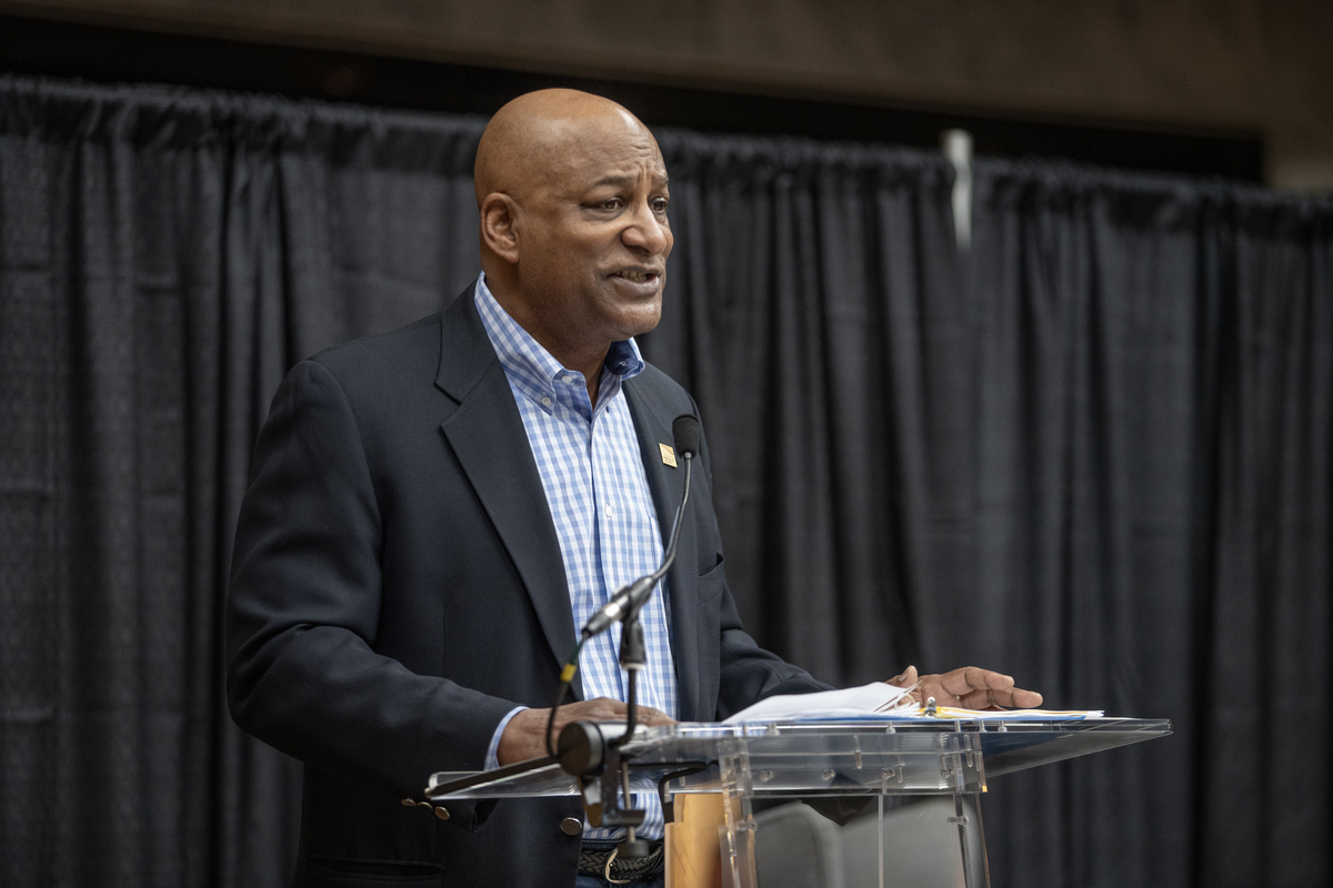 AARP Maryland President David Conway speaking at podium