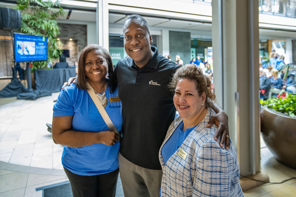 Calvin Ball posing with Jackie Scott and Ofelia Ross Ott 