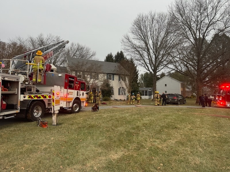 Engine in front of house on fire