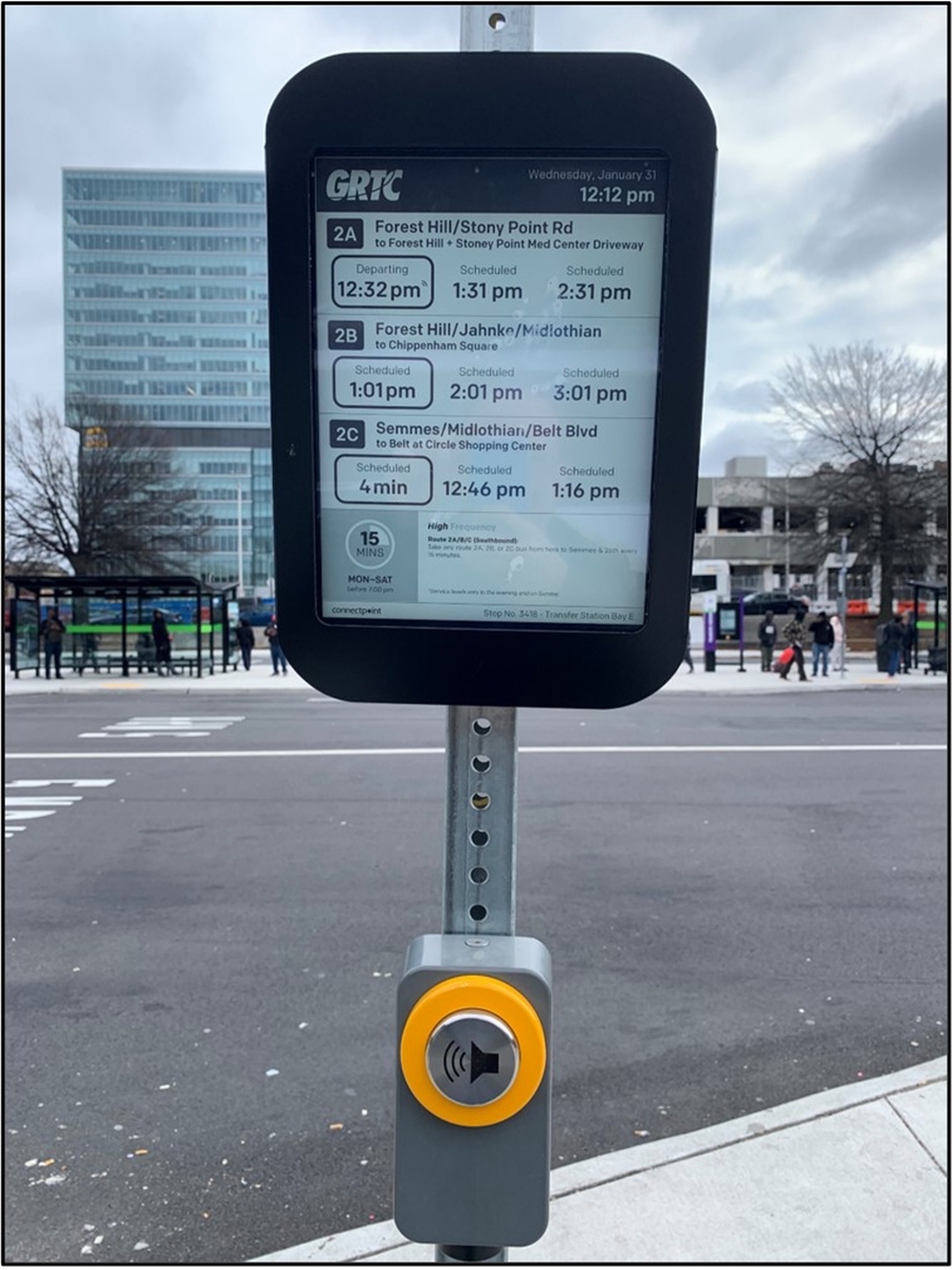 Image of Connectpoint 13-inch screen for Flash transit information mounted to a curb-side pole.