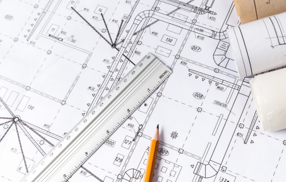 Image of blueprints with a ruler and pencil