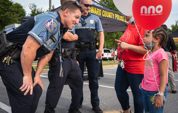 Officers talking to child at NNO