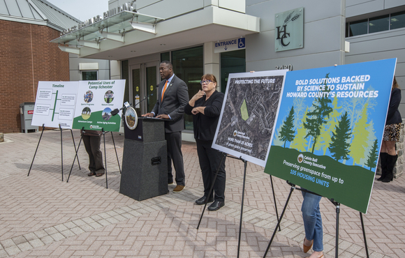 Calvin with info boards at mic.