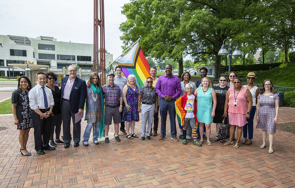 Group of residents with LGBTQ flag at the Lakefront