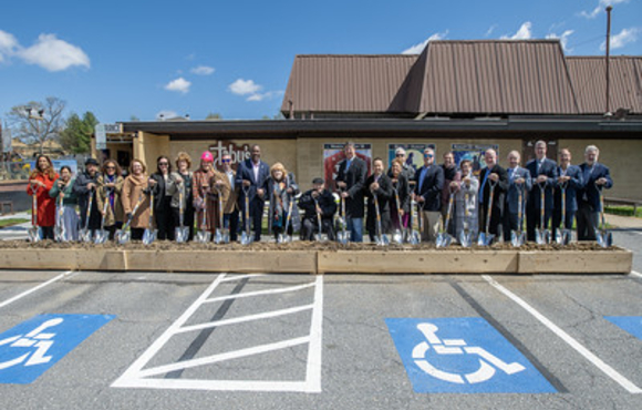 Group of dignitaries with shovels at groundbreaking of Performing Arts Center