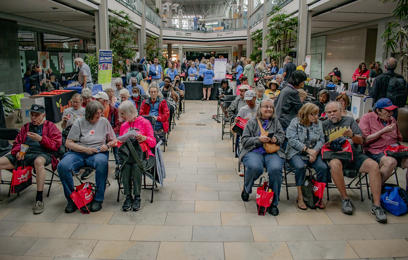 Full view of the audience at the showcase with mall in the background
