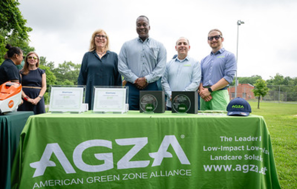 Officials behind a table of awards at AGZA announcement