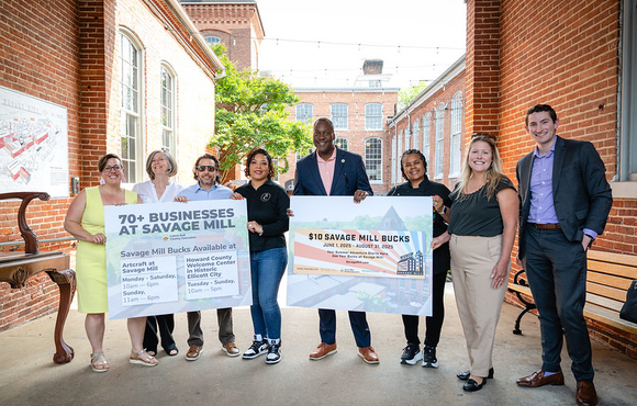 A photo of County Executive Calvin Ball outside of Savage Mill for his press conference to announce the launch of the new Savage Mill Bucks program offering visitors to the Mill a $10 business voucher.