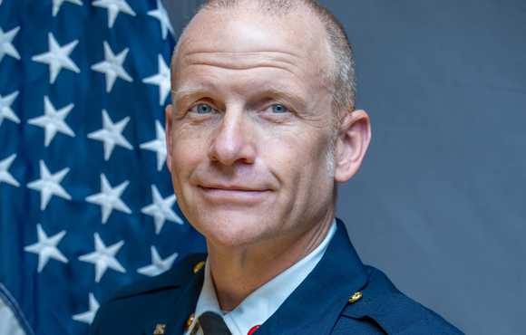 Jeremy Clancy in front of US Flag