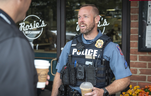 Officer talks to citizen at Coffee with a Cop