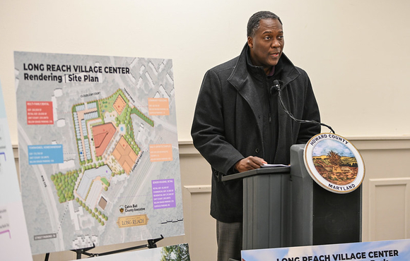 A photo of County Executive Calvin Ball speaking to attendees at this press conference to provide a comprehensive update on the County's Long Reach Village Center Revitalization Project.