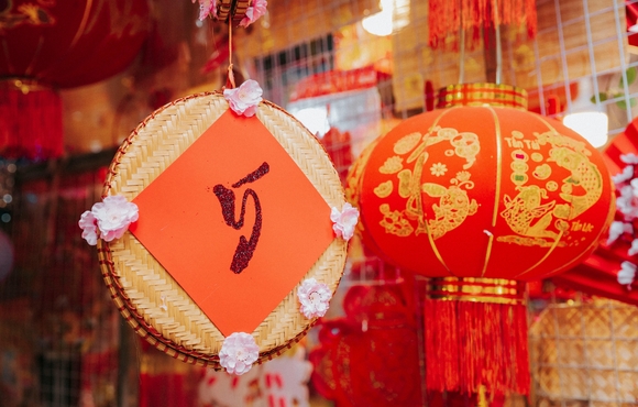 Images of red and gold lunar new year decorations.