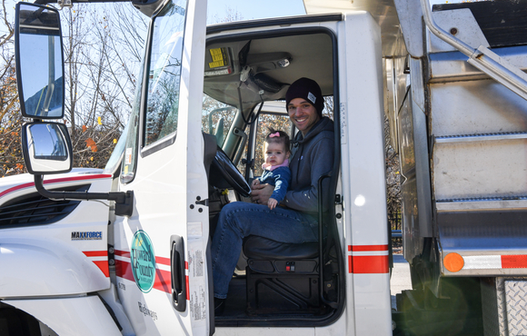 adult with child on lap in highways truck