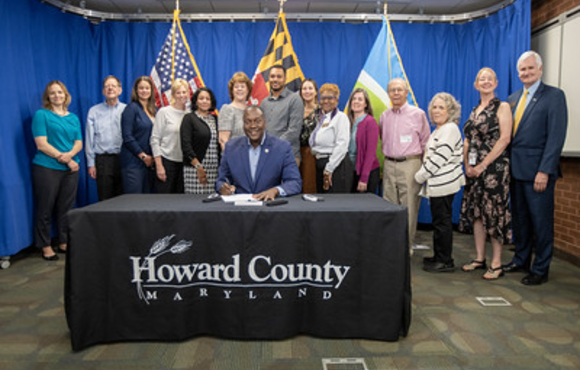 Group legislation signing allowing Age-Restricted Adult Housing Cottage Clusters