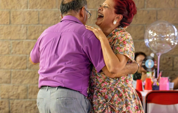 Caucasian couple dancing.