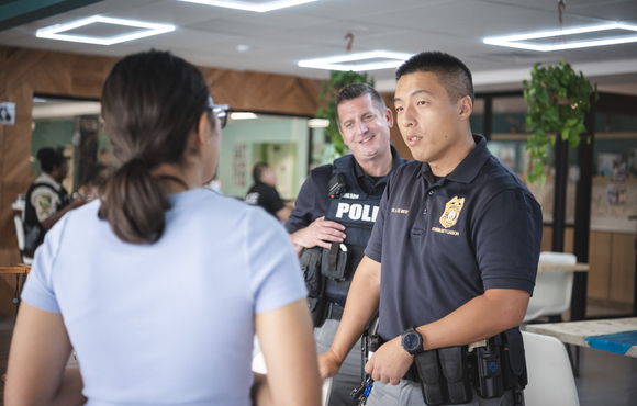 Officers speak with a woman