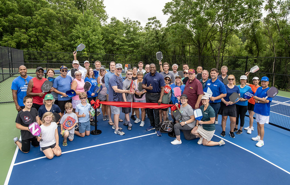 Ribbon cutting at opening of pickle ball court at Alpha Ridge Park