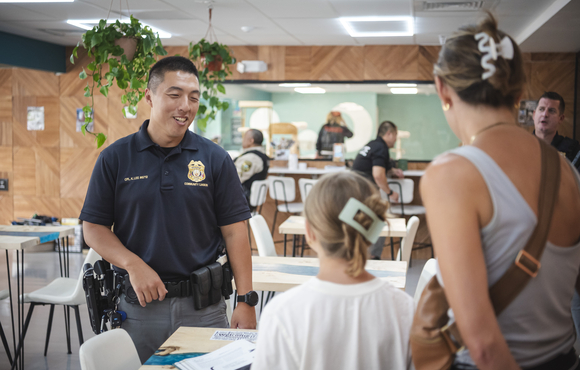 Officer talks to young girl and mom