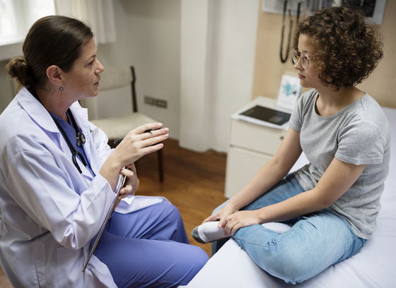 Teen with doctor