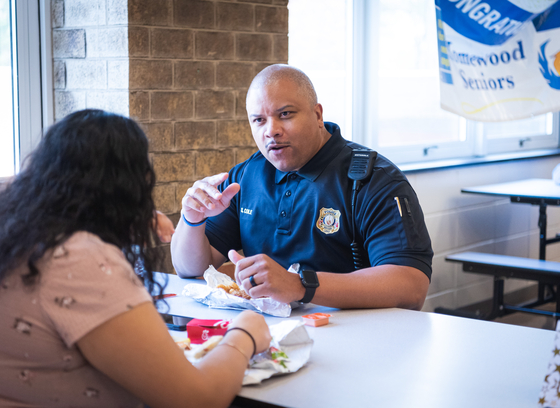 Office eats breakfast with high school student