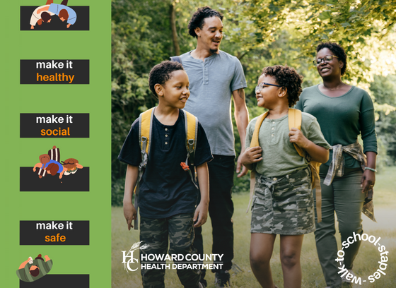 Family of 4. Two children carrying backpack and parents walking behind