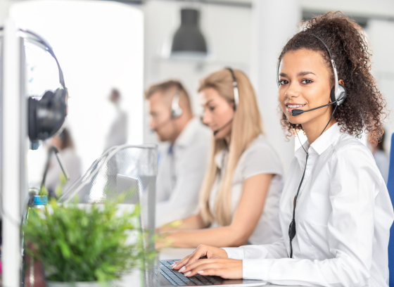 Call center with employees wearing headsets
