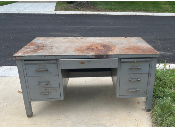 rusted metal table at curb