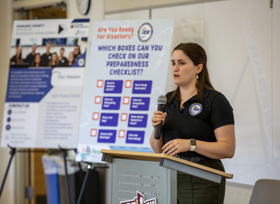 A member of staff presenting at a local emergency planning meeting