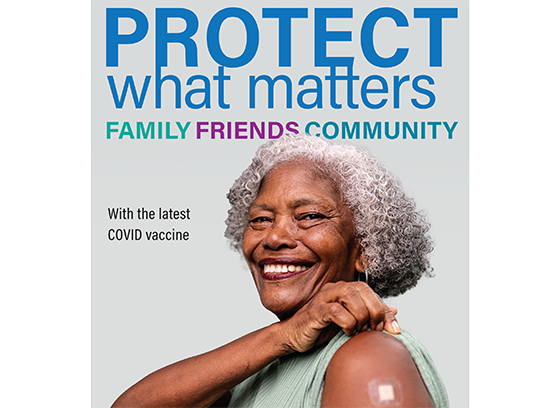 African American woman smiling and showing band-aid on upper arm. "Protect what matters. family. friends. community. with the latest COVID vaccine.