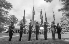 Honor Guard standing in front of the Honor and Remembrance Ceremony, black and white photo