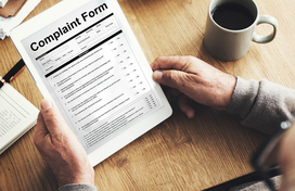 A person reviewing a complaint form.