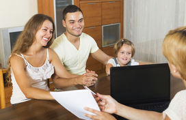 caucasian family - mother, father, child - speak with a counselor