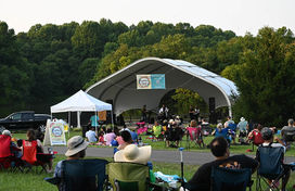crowd enjoys a concert at the Centennial Park amphitheater