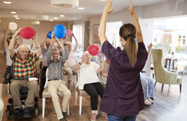 Carer Leading Group older adults in social day program 