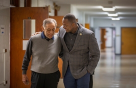 A photo of County Executive Calvin Ball walking with former Delegate Frank Turner Sr.
