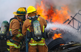 Fire fighters putting out fire.
