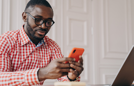 man checking email on cell phone