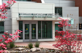 George Howard Building entrance with red dogwood blossoms