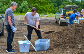 residents shoveling hocogro mulch