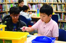 boy building with lego