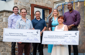 A photo of County Executive Calvin Ball and Howard County Arts Council Executive Director Coleen West with representatives from Baltimore Center Stage and Chesapeake Shakespeare Company their $12,500 checks for a one-time supplemental arts programming grant they were awarded.