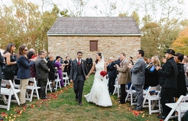 A newly wed couple walking down the aisle after their ceremony at Waverly Mansion. 